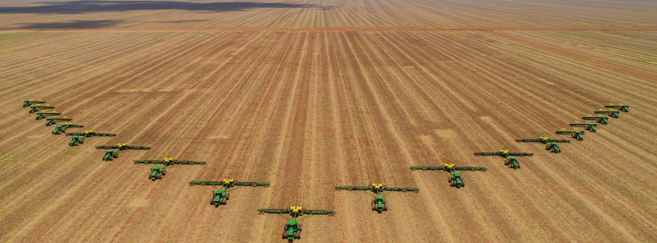 Chapadão do Sul / Mato Grosso do Sul / Brazil / February 26, 2020: Agriculture, Aerial image, number of machines in arrow motion, front of tractors that prepare the land to sow in the field